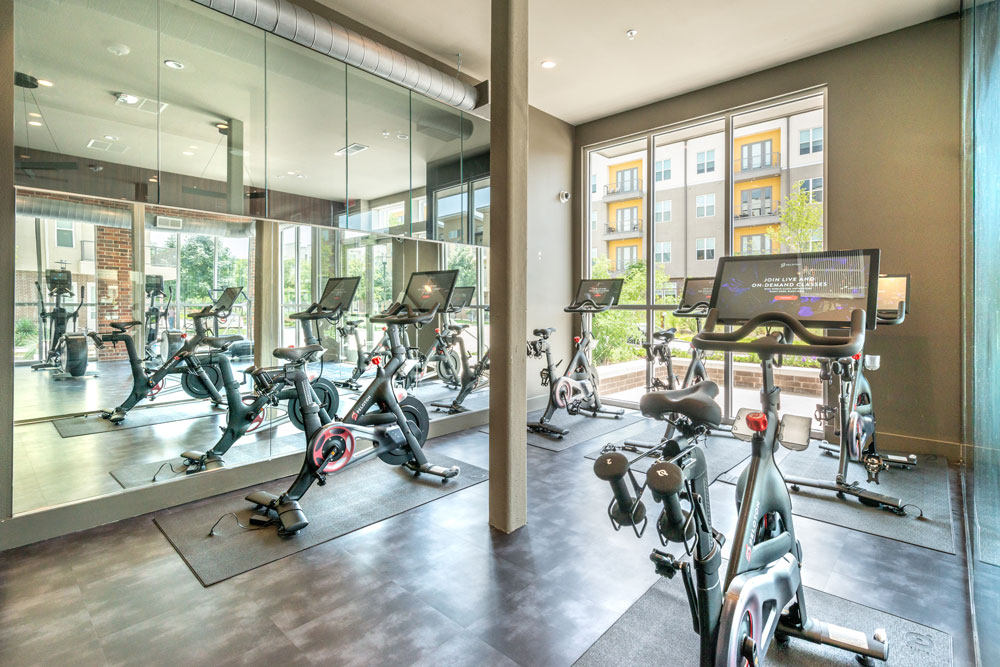 Fitness center with Peloton spin bikes and mirrored wall
