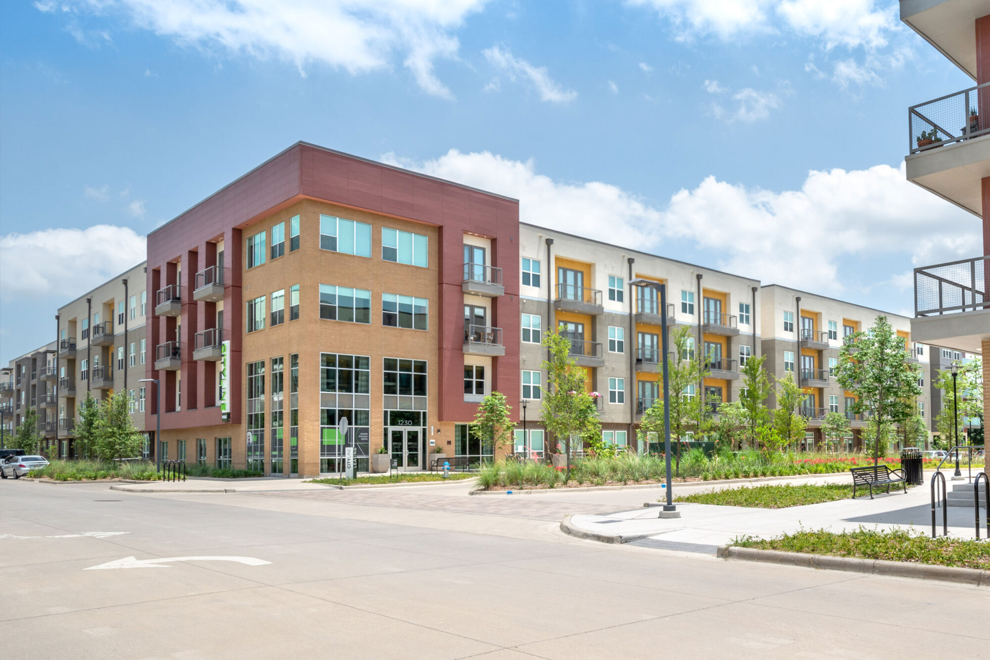 Apartment community exterior with professional landscaping